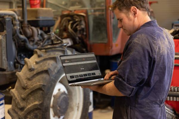 A tractor mechanic browses the new online shop at ProPart.co.nz