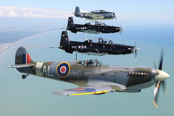 Past and present -  Air Force Heritage Flight aircraft the Spitfire (bottom of photo) and Avenger (top) flying in formation with Texans from the Central Flying School at Ohakea