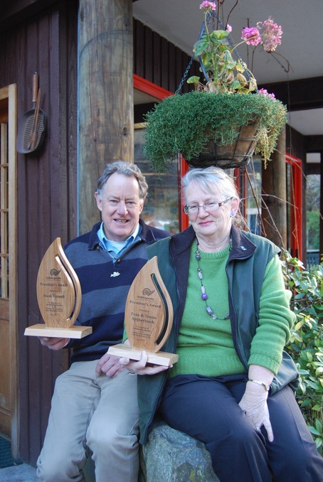 Erna Spijkerbosch from Queenstown Top 10 Holiday Park Creeksyde and Air Milford owner Hank Sproull with their President's Awards