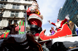 Santa's float journeys down Queen Street in the 2011 Farmers Santa Parade.