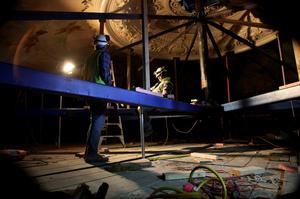  Preparing the ceiling dome for lowering into the auditorium.