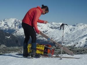 Erik Bradshaw reaches the Arawhata Saddle with the West Coast below