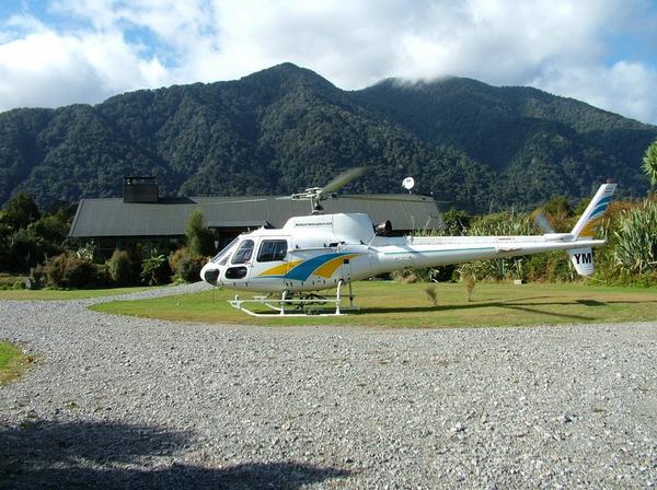 A helicopter outside Martin's Bay Lodge on the Hollyford Track.