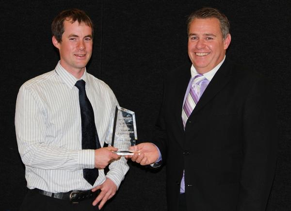 Andrew Rae of Southern Landmarx being presented with his award by Adam Pollard.