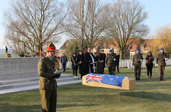 Alongside his countrymen at last. Lieutenant Colonel Nick Gillard opens the reburial service for the unknown soldier of the New Zealand Rifle Brigade at the Messines Ridge British Cemetery last week.