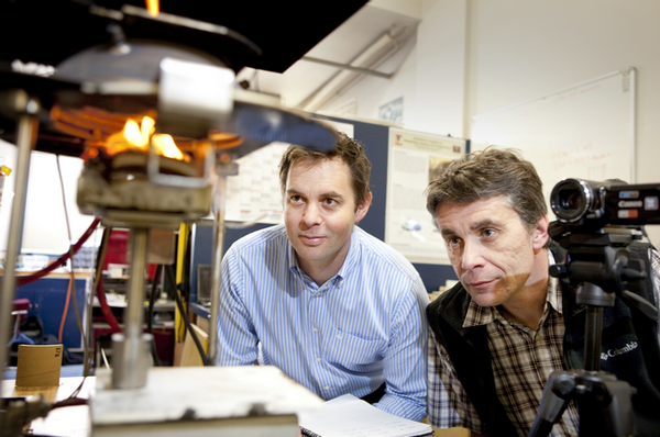 Holmesfire senior fire engineer Michael Inwood (left) and UC's Dr Michael Spearpoint test the material for the new Christchurch cardboard cathedral.