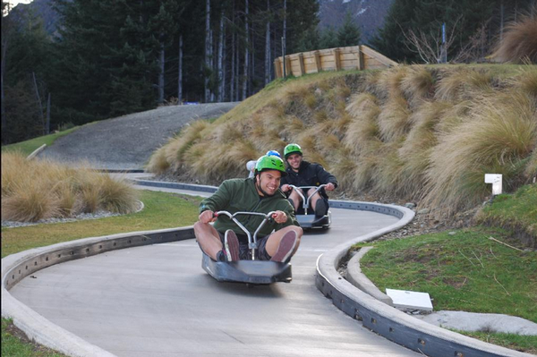 Sam Rapira (front) and Steve Rapira race each other down the luge track.