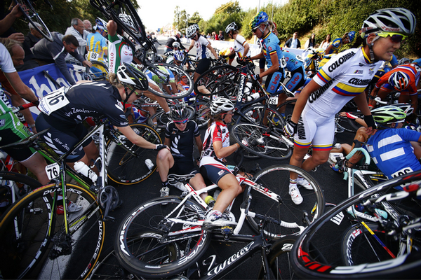 Linda Villumsen (left) checks on teammate Kate Chilcott after a mass crash in the women's road race at the world championships in the Netherlands today.