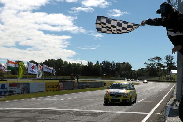 Rangiora's Chris Cox takes a comfortable win from an intense opening race at this weekend's penultimate round of the 2011/2012 Suzuki Swift Sport Cup at Manfeild today.