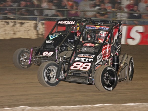 Michael Pickens, #88 CRC Synergy Racing car, in action during the Chili Bowl with race winner Kevin Swindell in the #39 car