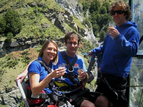 Relaxing with a few bubbles and getting ready to celebrate Shotover Canyon Swing's 10th birthday celebrations with a new 'Cheer Chair' tandem chair jump are Sales manager Claire Stewart and General Manager Matt Hollyer with Operations Manager Harry (Brad Cutler).