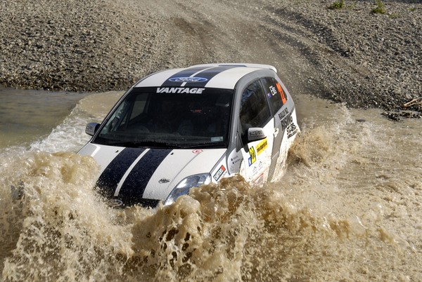  Zealand's 2010 Rising Stars Scholarship winner Stephen Barker, age 21 from Hamilton, splashes his way to victory in the Group N two-wheel-drive class at Rally Otago