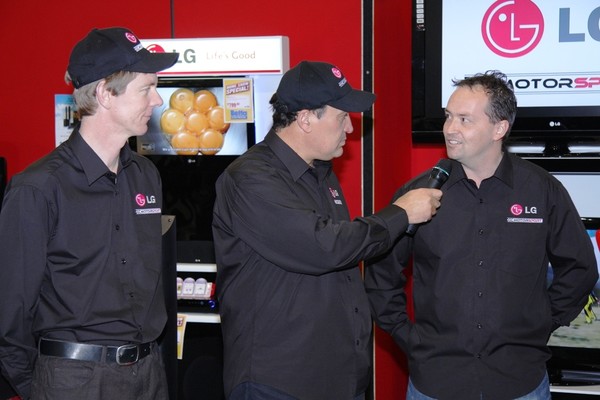 New Zealand V8s Championship contender Angus Fogg (left) at the public launch of his new LG Electronics-sponsored race team with MC Clint Brown (centre) and car owner Kevin Williams (right).