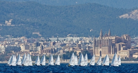 The Laser Radial fleet sails against the spectular back drop of Mallorca