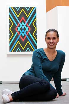 Tegan Hautapu with her artwork