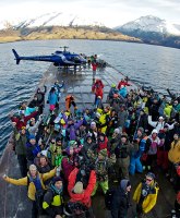 Snow sports athletes cross Lake Wanaka on the way to the next challenge