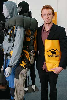 Nick Graham, alongside a model showing how his alpine recuse harness would work.