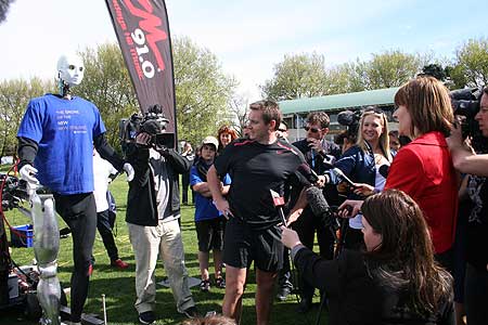 Former All Black Andrew Mehrtens eyes up his opponent, Robo Dan, a rugby ball-kicking robot created by students at the School of Engineering and Advanced Technology, Albany